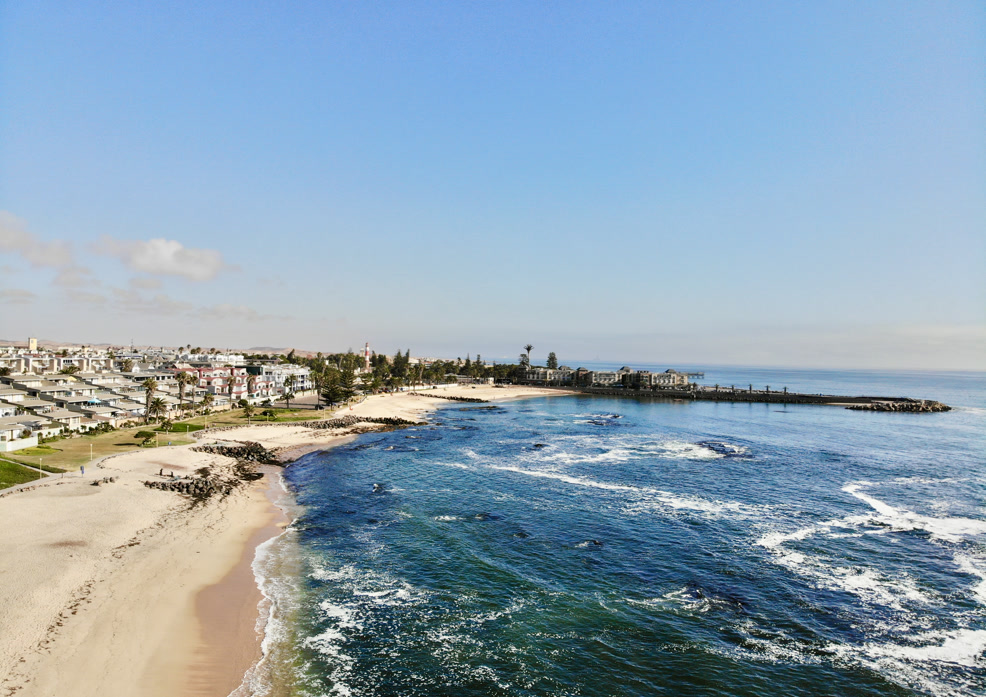 Swakopmund coastline with dunes beyond the ocean