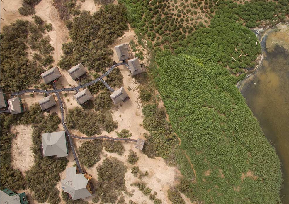 Aerial view of The Stiltz bungalows beside the lagoon