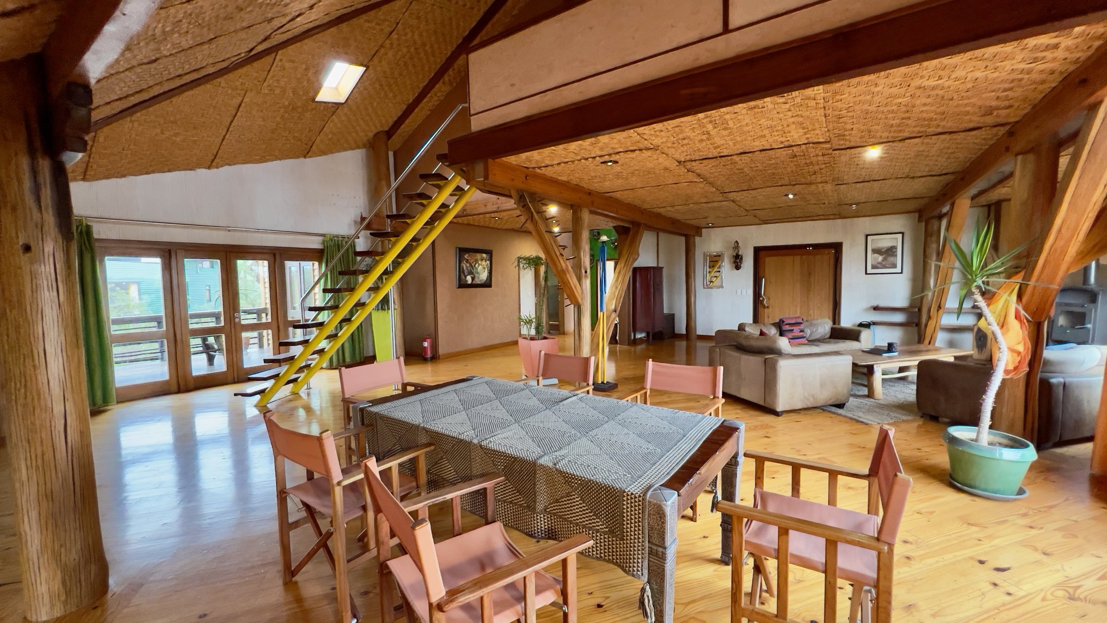 Villa open-plan living and dining area with staircase