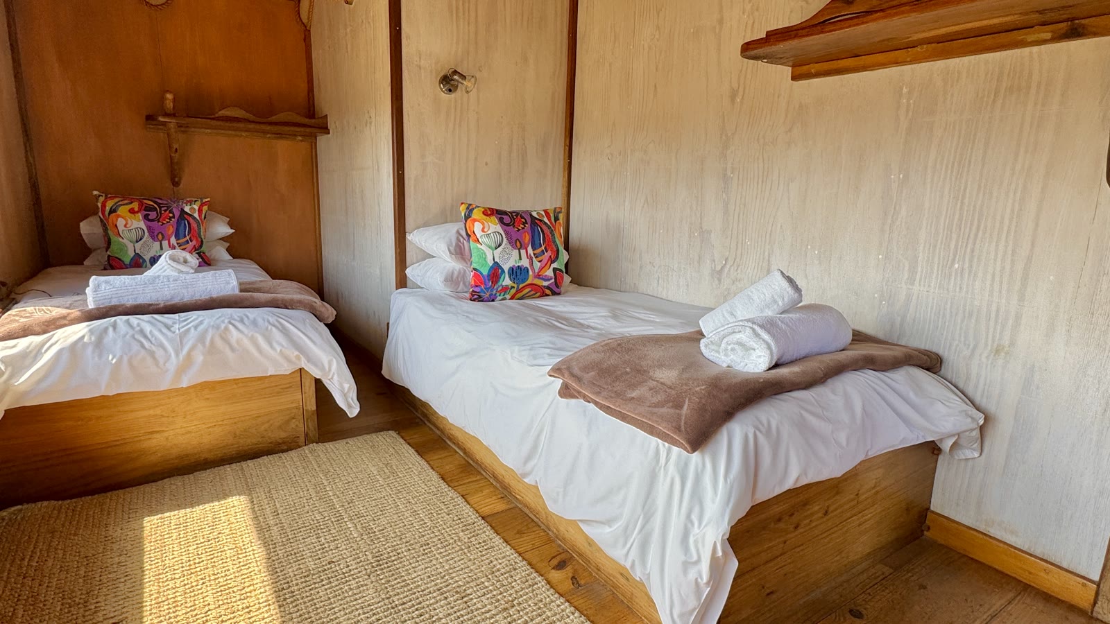Family Bungalow twin beds with colourful cushions and fresh towels