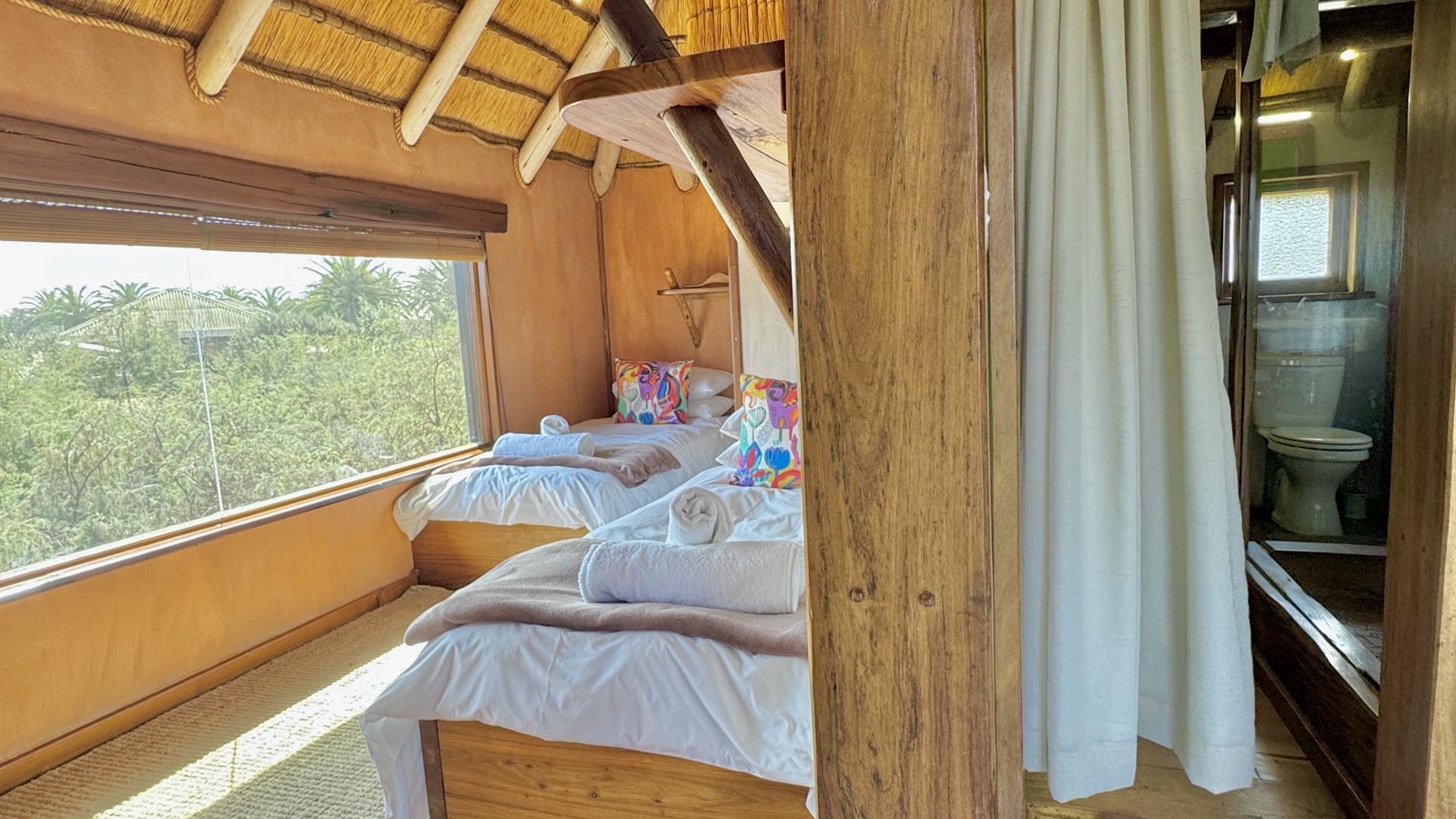 Family Bungalow twin bedroom with the bathroom entrance alongside