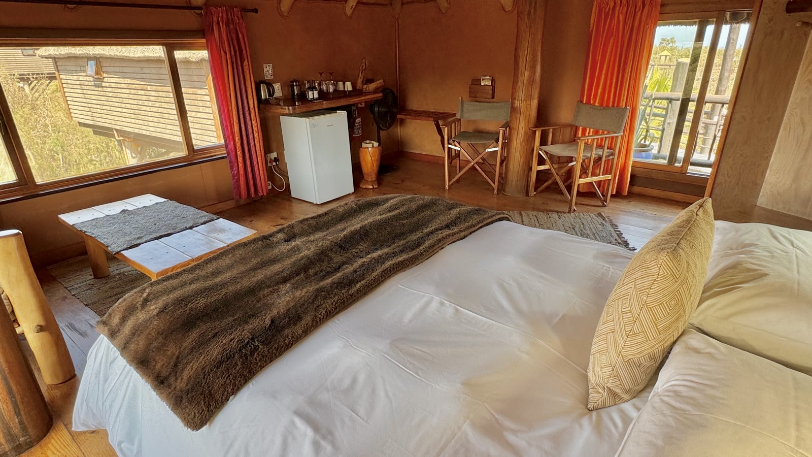 Family Bungalow double bedroom with seating, amenities and balcony access