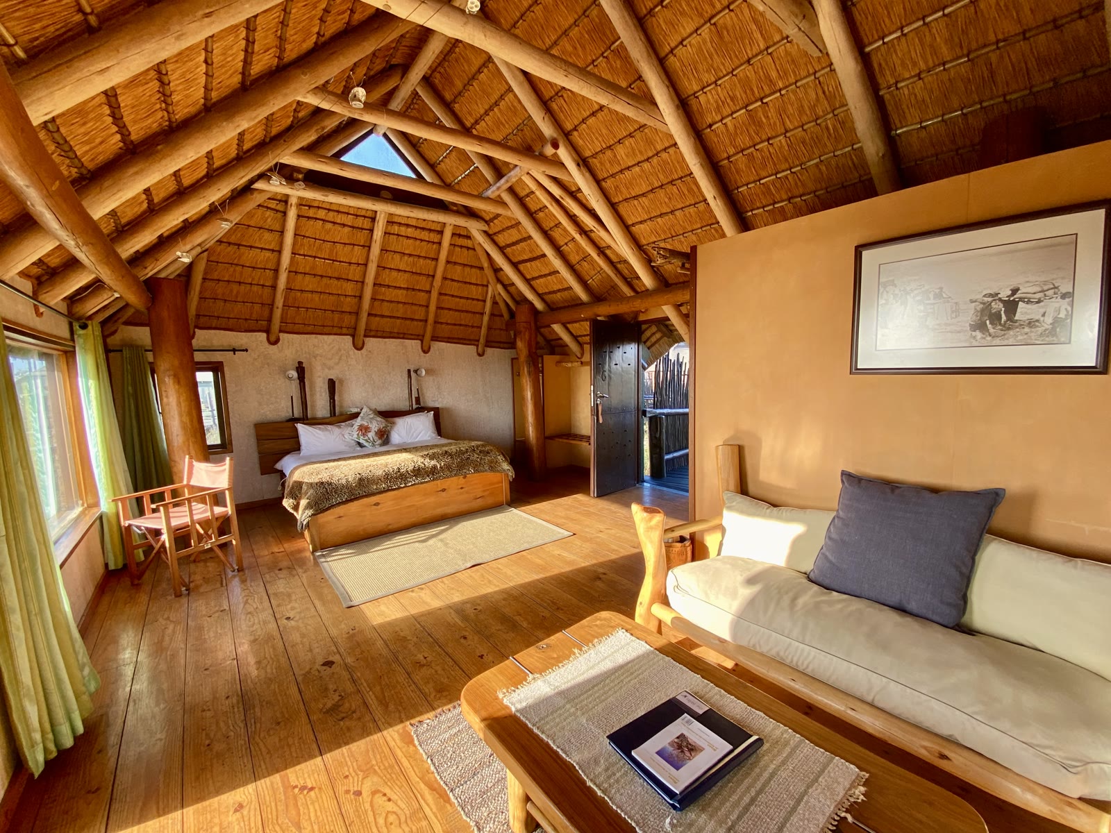 Lagoon Bungalow double bedroom and lounge beneath the thatched roof
