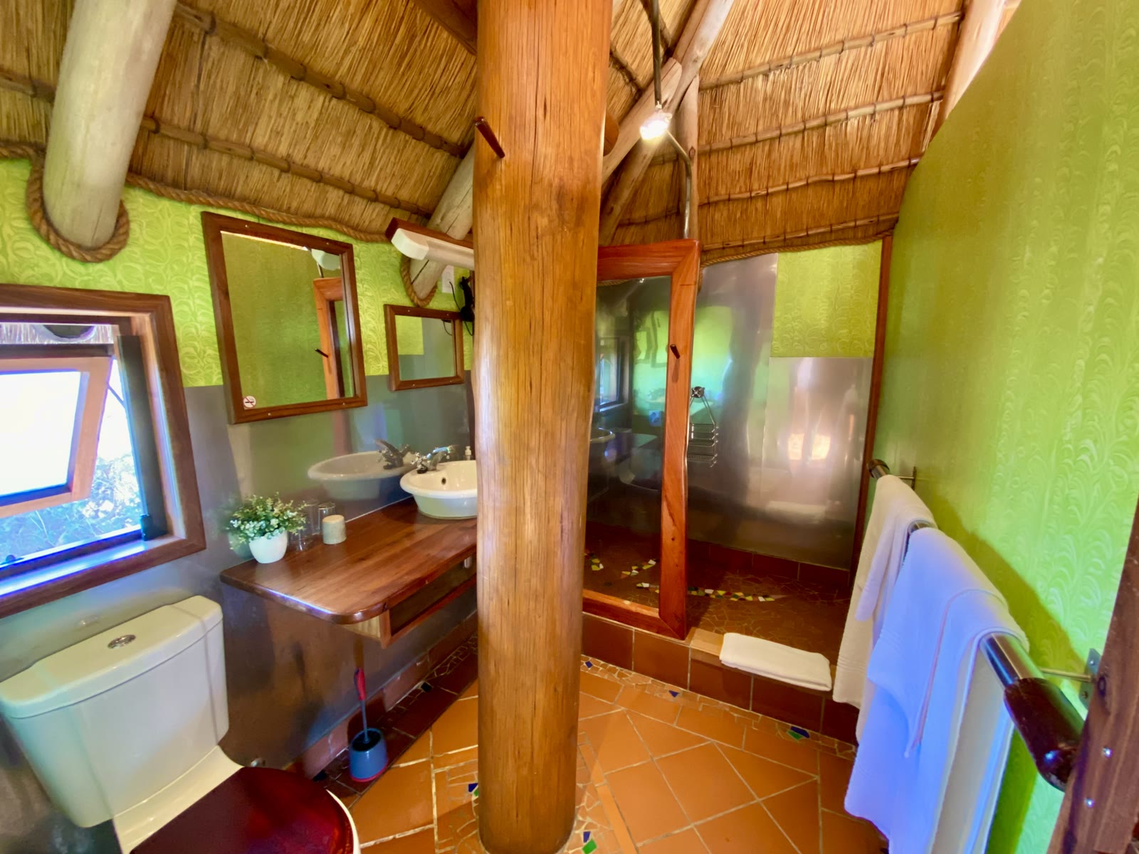 Lagoon Bungalow bathroom with twin basins and a walk-in shower