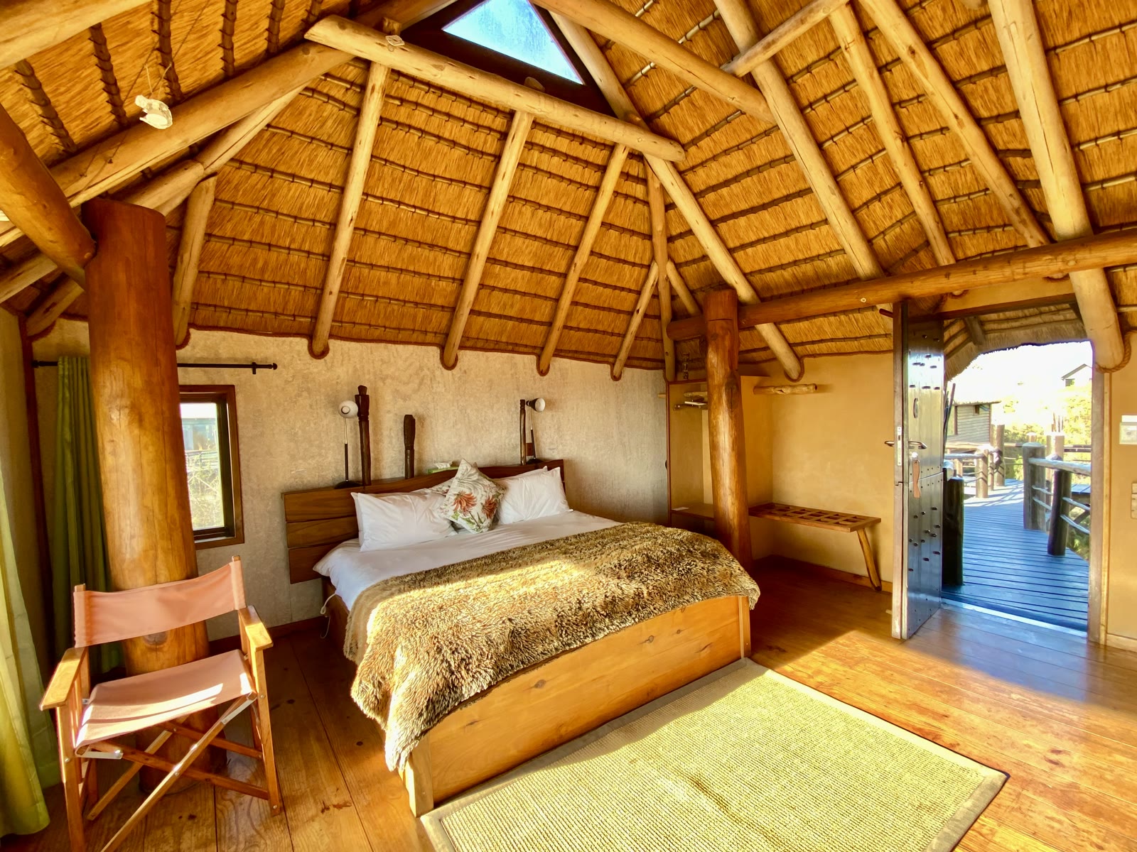 Villa double bedroom beneath the warm thatched roof