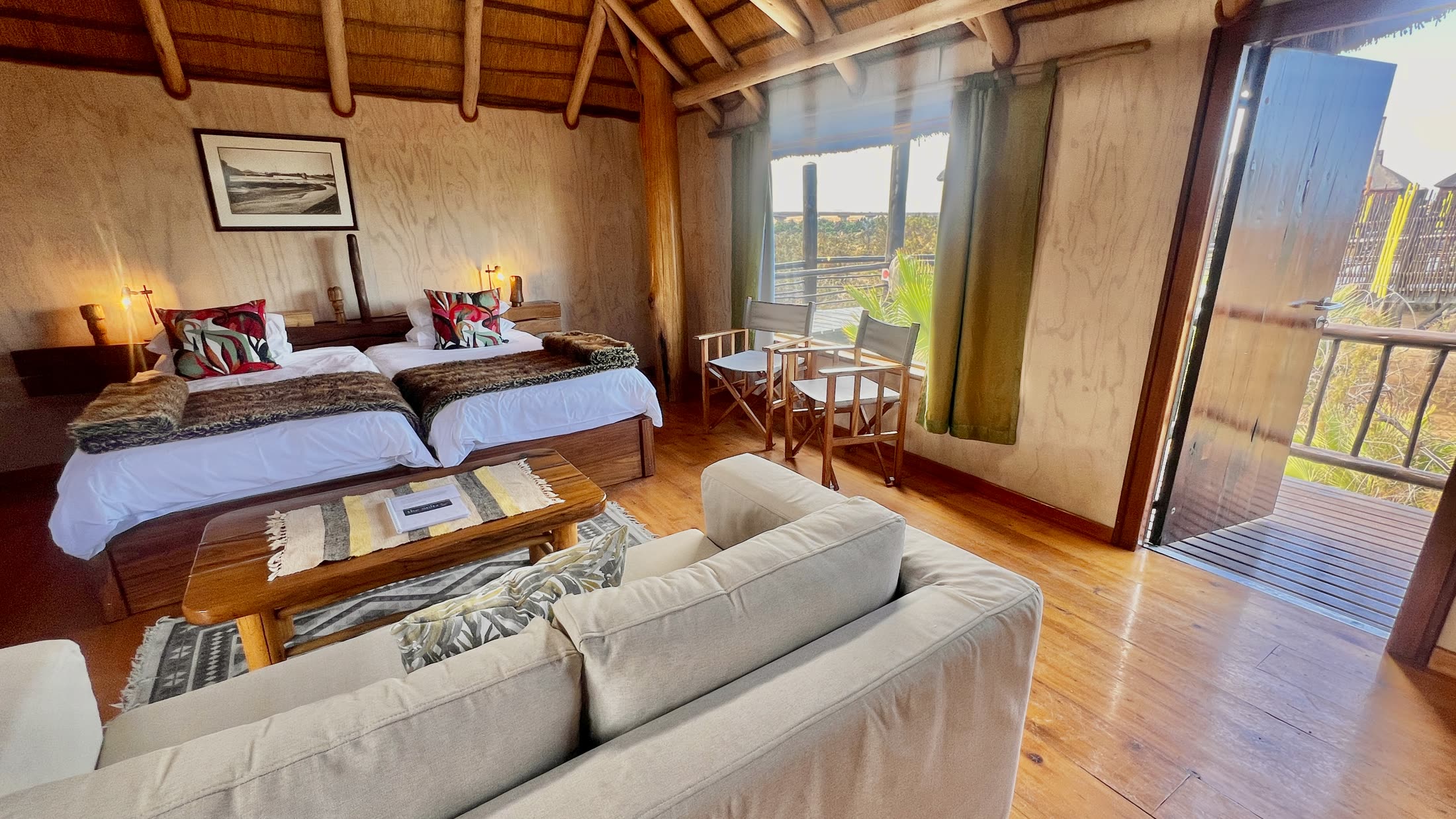 Lagoon Bungalow double bedroom and lounge opening to a balcony