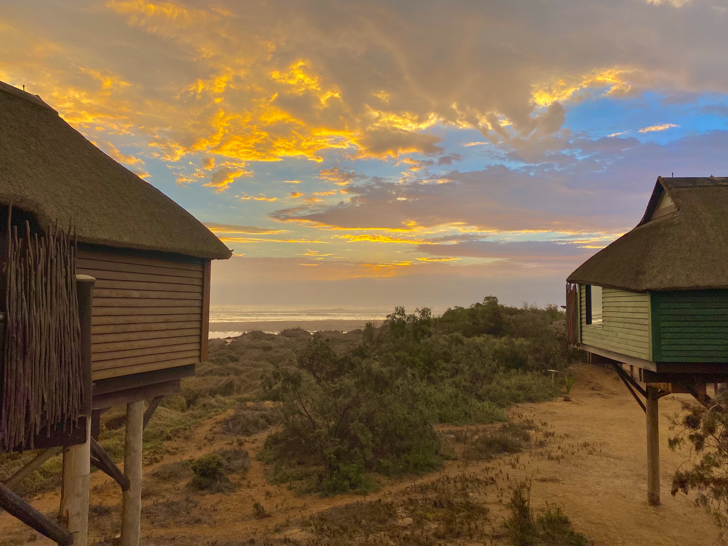 Bungalow exterior at sunset with sea views