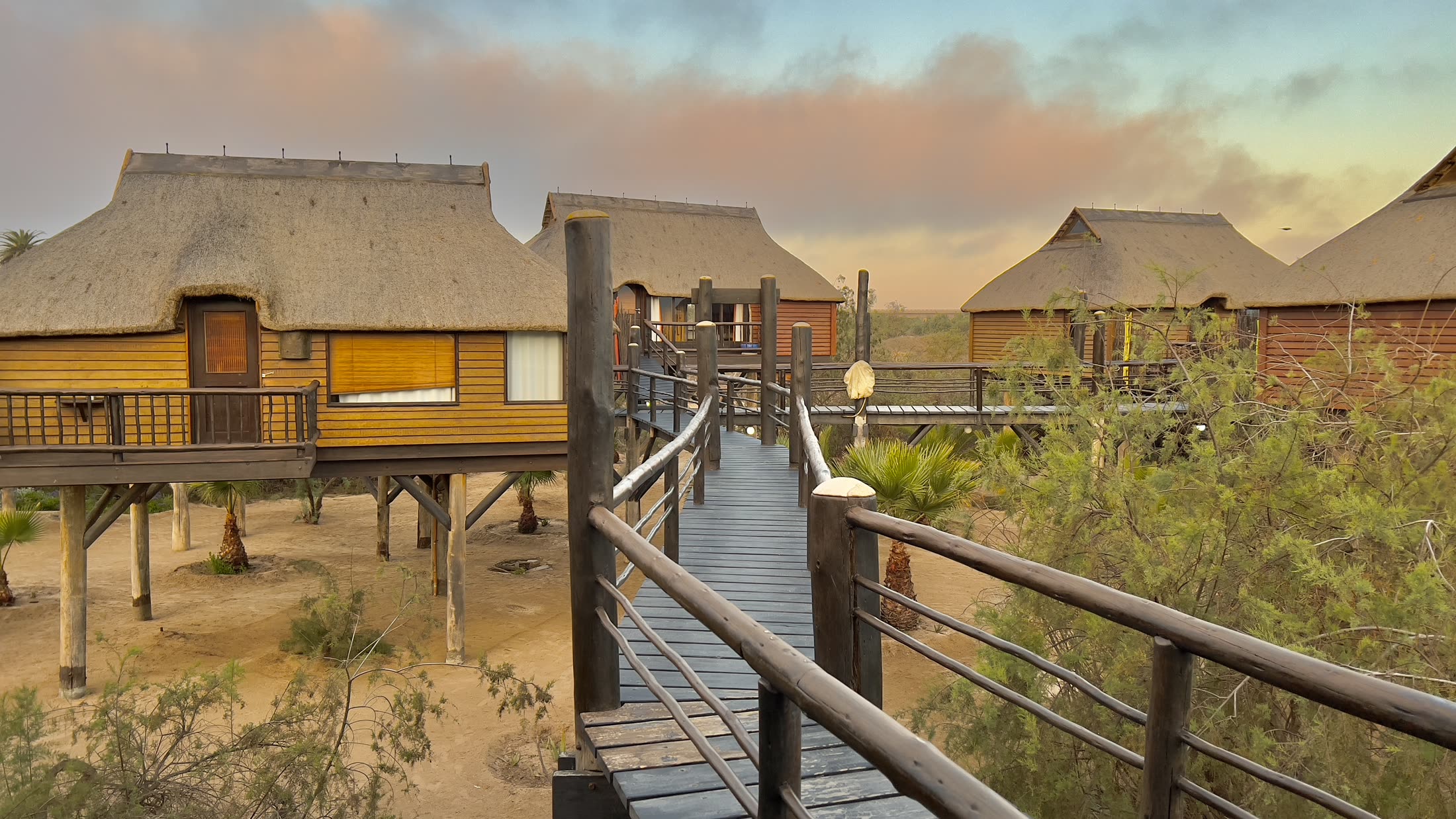 Lagoon Bungalows and walkways at dusk