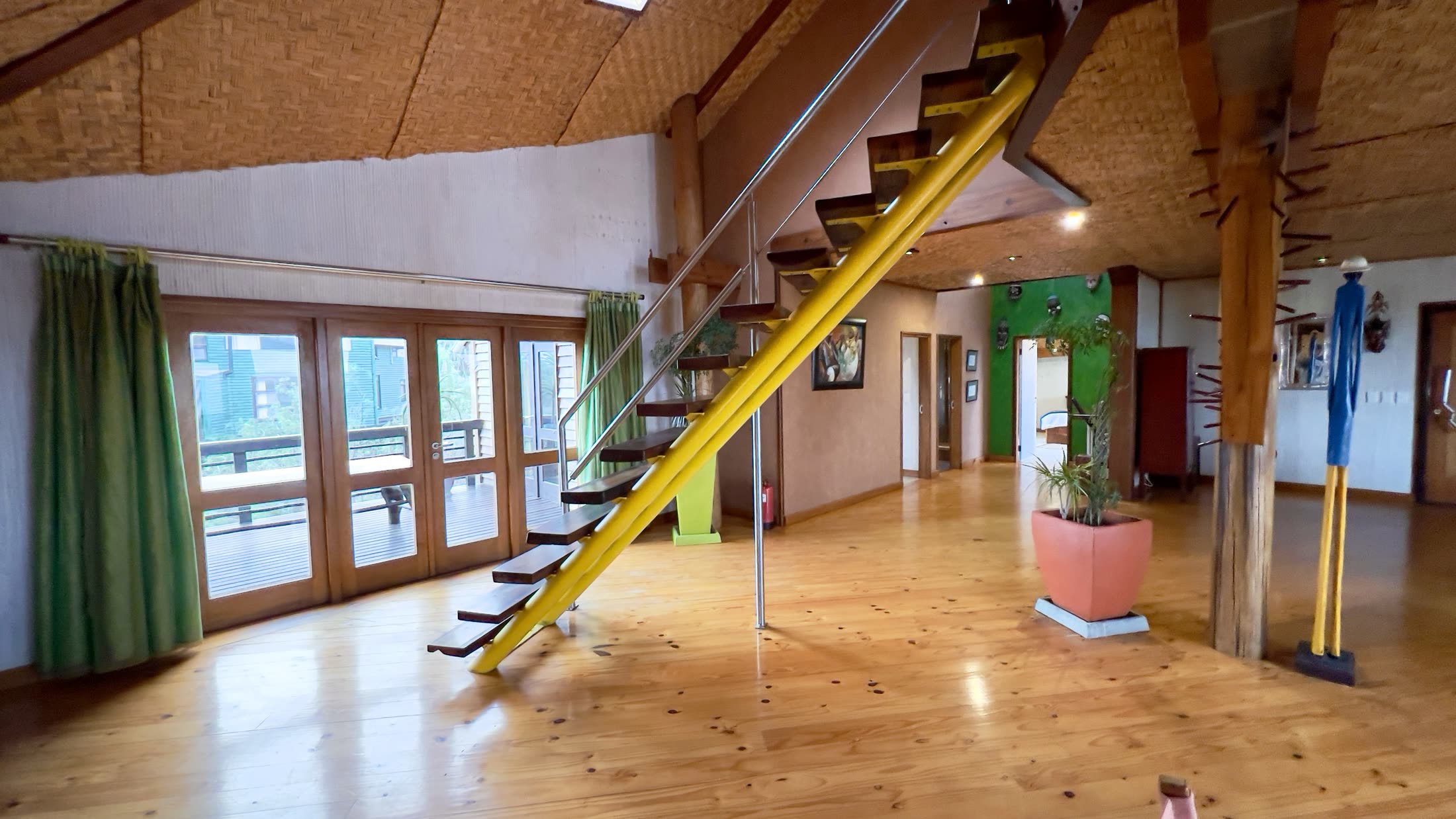 Villa open-plan living space with dining area and staircase